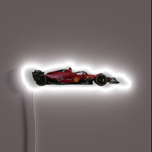 Load image into Gallery viewer, For the die-hard tifosi, this neon piece captures the sleek silhouette of the 2022 Scuderia Ferrari F1 car in full throttle. A glowing tribute to racing passion, Italian pride, and pure speed. 🏎️💨