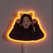 Load image into Gallery viewer, Alt text: "Neon sign of a smiling anime-style girl with cat ears and whiskers, glowing in orange light."
