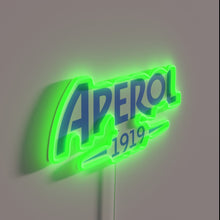 Load image into Gallery viewer, Vibrant neon Aperol blue logo glowing in modern Italian style bar.