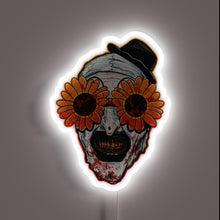 Load image into Gallery viewer, Terrifier 2 neon sign – Art the Clown in bloody detail with creepy sunflower sunglasses and top hat. A chilling horror piece for fans of the cult slasher film.