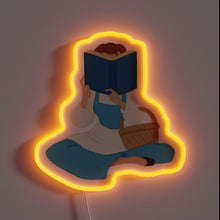Load image into Gallery viewer, This neon sign features a cozy silhouette of Belle from *Beauty and the Beast*, sitting with a book and basket, glowing in a soft orange light – a perfect tribute for Disney lovers and bookworms alike.