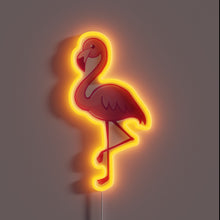 Load image into Gallery viewer, Alt text: "Neon sign of a pink flamingo standing on one leg, outlined with a glowing orange-red light."