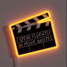 Load image into Gallery viewer, Movie clapperboard neon sign with “I Speak Fluently in Movie Quotes” text – fun wall decor for film lovers, home theaters, or entertainment rooms