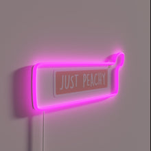 Load image into Gallery viewer, Add a touch of whimsy with this peach-colored neon sign.