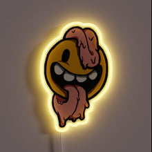 Load image into Gallery viewer, Melting smiley face neon sign with exaggerated long tongue and yellow glow.