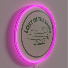 Load image into Gallery viewer, Vibrant neon sign featuring stylized typography with sauce theme