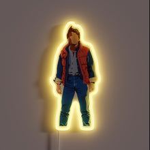 Load image into Gallery viewer, Back to the Future inspired neon sign with Marty McFly silhouette and glowing yellow outline.