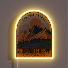 Load image into Gallery viewer, Million Dollar Highway Colorado neon sign with mountain silhouette and glowing arch.