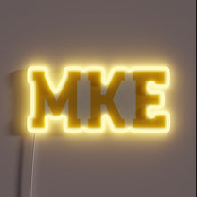 Load image into Gallery viewer, Brighten up your space with this vibrant navy neon sign.
