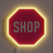 Load image into Gallery viewer, Vibrant pink neon sign reading 'shop' in modern RGB style.