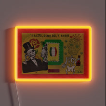 Load image into Gallery viewer, Vibrant RGB Lighting Illuminates Salud Dinero y Amor Skull Design