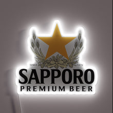 Load image into Gallery viewer, Vibrant Sapporo Brewery Logo Displayed in Colorful Neon Lights