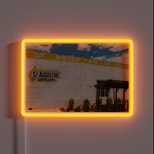 Load image into Gallery viewer, RGB neon sign illuminates historic St. Augustine Distillery at night
