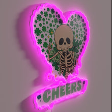 Load image into Gallery viewer, Lovely skeleton cheers in St. Patrick's Day spirit with colorful glow.