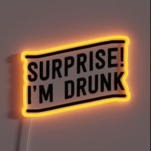 Load image into Gallery viewer, Luminous 'Surprise I'm Drunk' neon sign with vibrant RGB colors