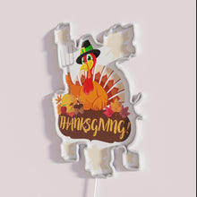Load image into Gallery viewer, Vibrant neon thanksgiving decoration with basting oven lamp humor style.