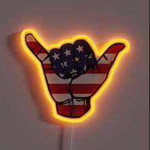 Load image into Gallery viewer, Patriotic shaka hand gesture with American flag design and orange neon glow.