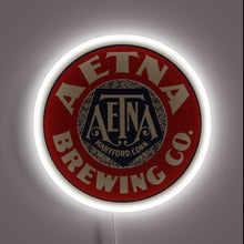 Load image into Gallery viewer, Vintage Aetna Beer advertisement with colorful neon light accents glow.
