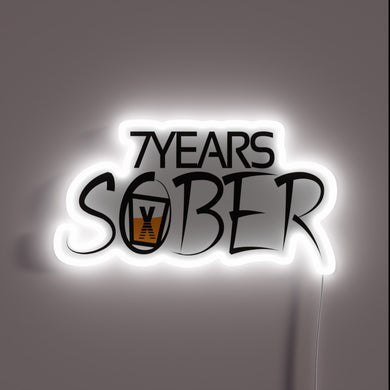 Recovery milestones celebrated with vibrant 7 years sober LED light.