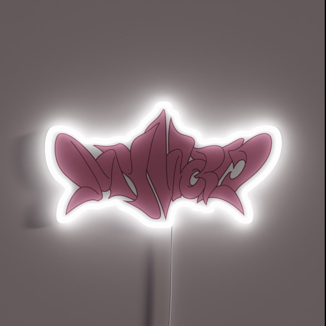 Aespa's vibrant pink neon logo shines brightly in the darkness
