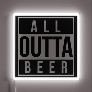 Fun neon bar decoration with a humorous beer shortage message.