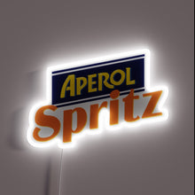 Load image into Gallery viewer, Alt text: *Aperol Spritz neon sign with bold orange and yellow logo glowing on a dark background.*