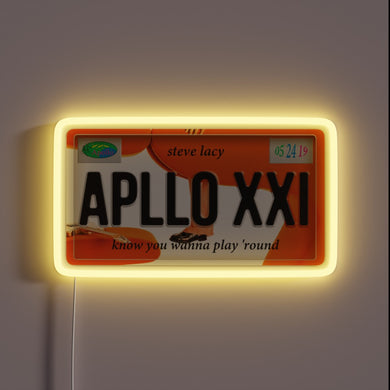 Steve Lacy “Apollo XXI” neon sign styled as license plate.