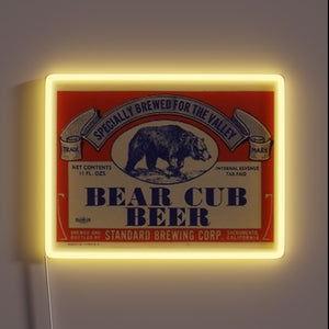 Add fun to your bar with this bear cub beer sign