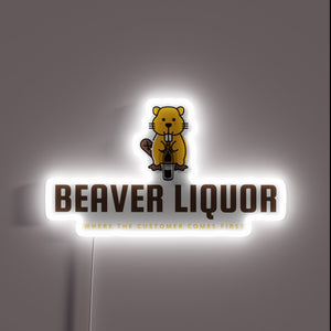 Neon sign advertising humorous 'Customer Always Drinks' liquor store slogan.