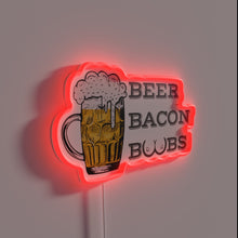 Load image into Gallery viewer, Neon sign featuring bold beer, bacon, and boobs theme artwork.
