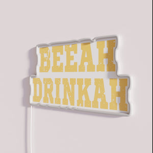 Vibrant neon bar decor with RGB colorful beer drinker sign.