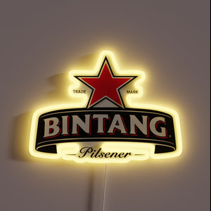 Indoor bar decoration featuring multicolor neon Bintang beer logo.