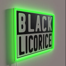 Load image into Gallery viewer, Add nostalgic style with a bold black licorice neon sign.
