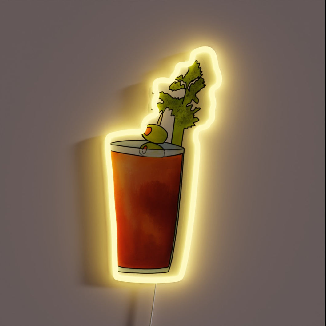 Neon sign shaped like a Bloody Mary cocktail with celery stalk and olive garnish, glowing in yellow.
