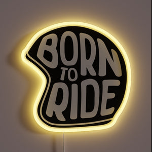 "Born to Ride" neon sign shaped like a helmet – bold and biker-inspired.
