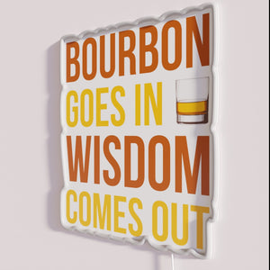 Colorful Neon Sign with Inspirational Quote 'Bourbon Goes in Wisdom Comes Out'