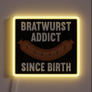 Vibrant Neon Sign Advertising Traditional German Bratwurst Flavor since Birth