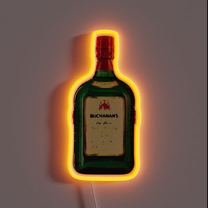 Alt text: *Neon sign shaped like a green Buchanan’s whiskey bottle with glowing orange outline on a dark wall.*