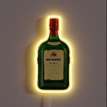 Load image into Gallery viewer, Neon sign shaped like a Buchanan&#39;s bottle with a yellow glow.
