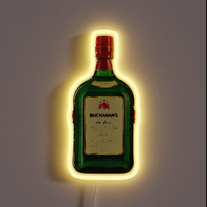 Neon sign shaped like a Buchanan's bottle with a yellow glow.
