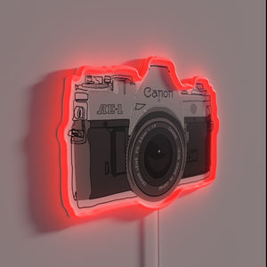 Vintage camera design illustration in bold RGB neon glow accents.