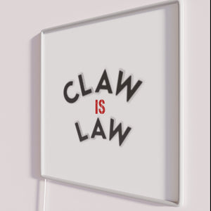 Add feline flair to your space with Claw Is Law Sign