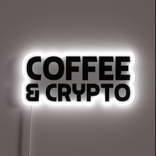 Load image into Gallery viewer, Neon sign with bold black text reading “COFFEE &amp; CRYPTO” outlined by a glowing white light.
