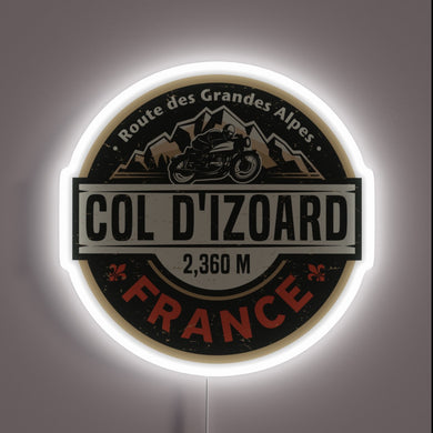 Neon sign showcasing **Col d'Izoard** design with motorcycle and mountain graphics — glowing wall decor for alpine riders and French Alps lovers.