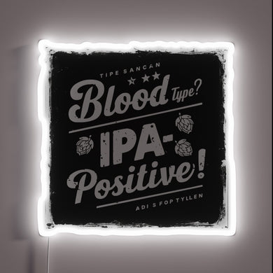 Neon sign featuring bold RGB colors and beer typography
