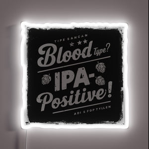 Neon sign featuring bold RGB colors and beer typography