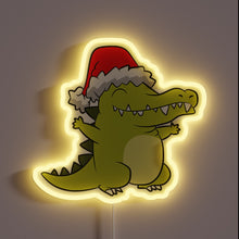 Load image into Gallery viewer, Cute crocodile neon sign wearing a Santa hat — festive and playful holiday decor.