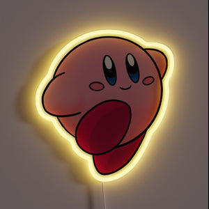 Pink cartoon character (Kirby) neon light with a soft yellow glow, featuring a cheerful expression and a raised red foot.