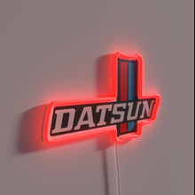 Load image into Gallery viewer, Vintage Datsun 620 car logo lit up with vibrant RGB neon.