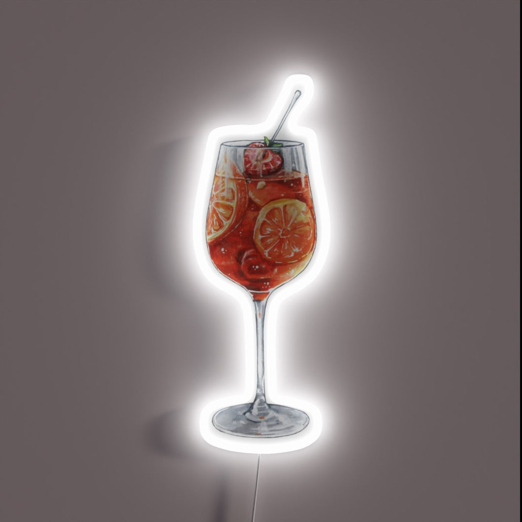 Bright citrusy aperol spritz cocktail garnished with colorful fruit slices